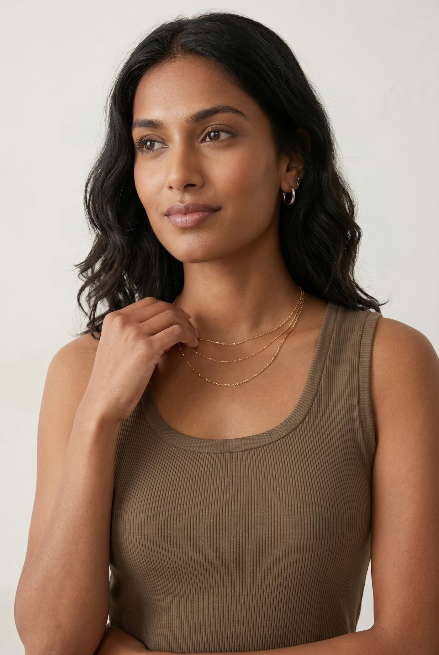 Woman wearing the Staple Scoop Tank in brown Truffle