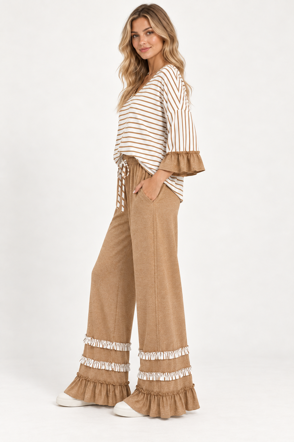 Three-quarter view of the Tess Striped Ruffle Set in Camel, showing the wide-leg pants and ruffled cuffs.
