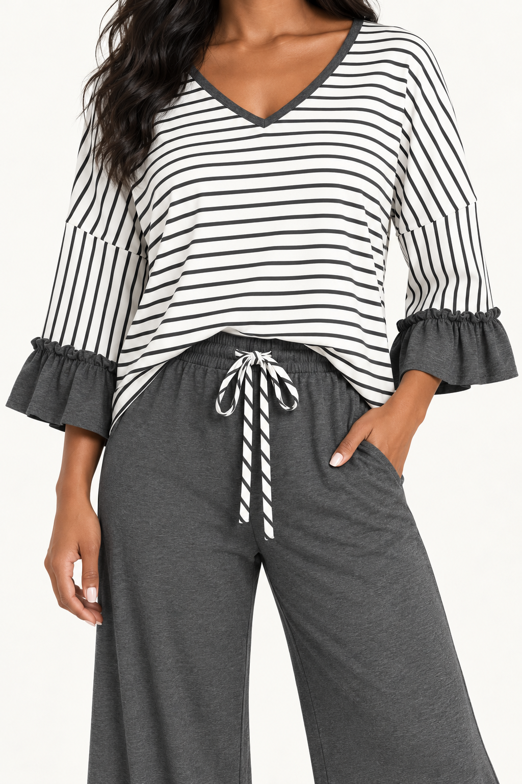 Close-up of the Tess set in Charcoal, showing the striped V-neck, ruffled cuffs and striped waist tie.