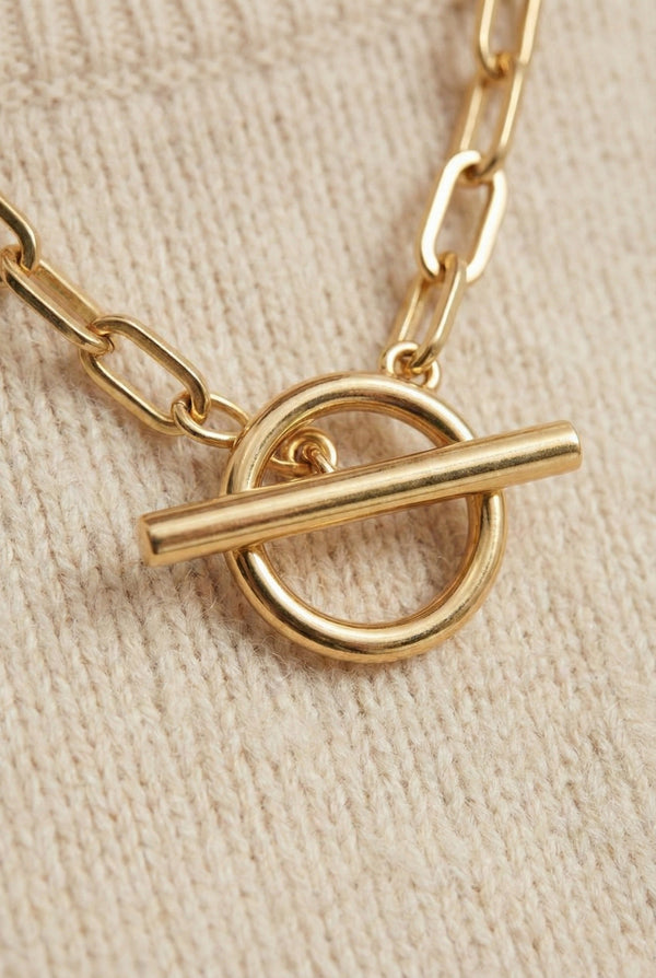 LOHNR The Uniform Chain in Brushed Gold. A premium 18k gold plated paperclip choker necklace featuring a clean toggle closure.