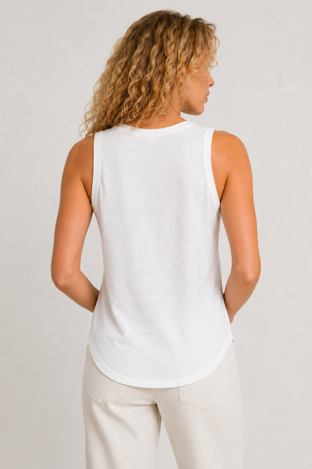 Woman wearing the Lohnr Zarah Tank with a scoop neck and effortless fit