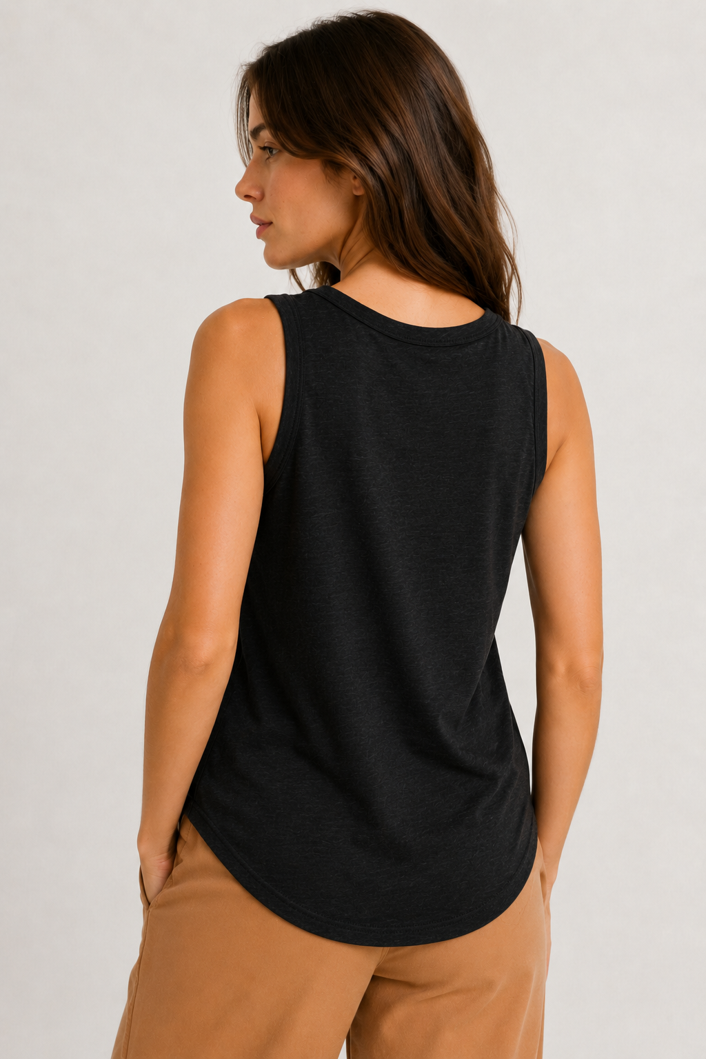 Woman wearing the Lohnr Zarah Tank with a scoop neck and effortless fit